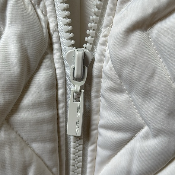 Bebe small vest with hoodie in white with fuzzy trim and fuzzy balls - Picture 7 of 7